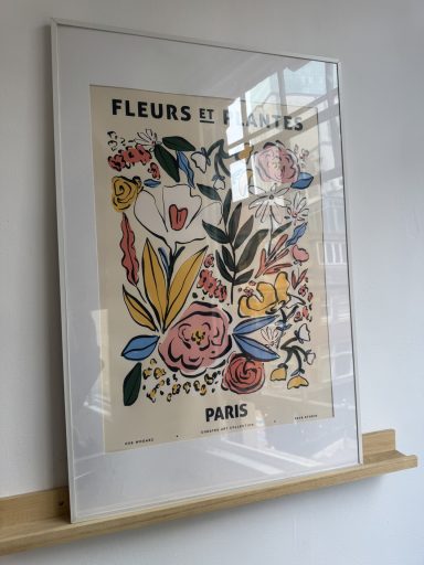 Framed vintage floral poster featuring colourful flowers and "PARIS" text.
